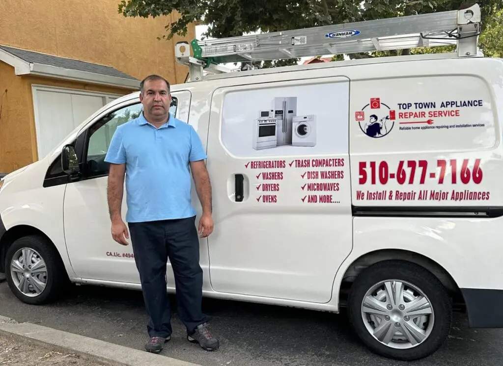Top Town technician Masood next to the white Top Town Appliance Repair Service van