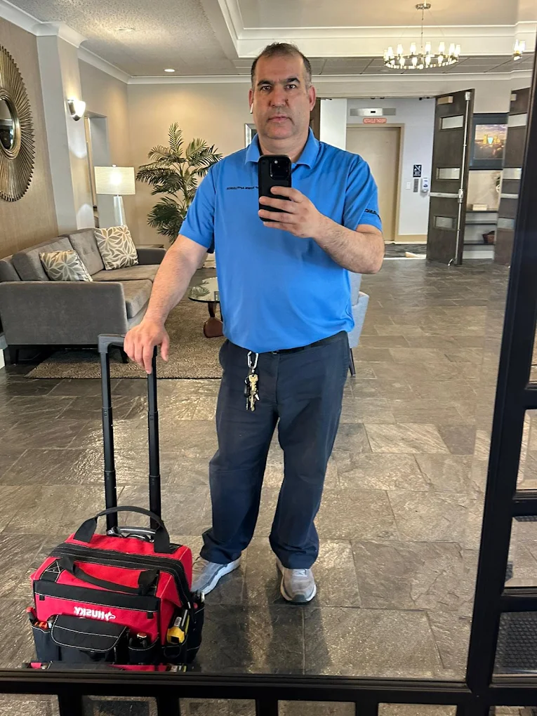 Top Town technician with a rolling tool bag